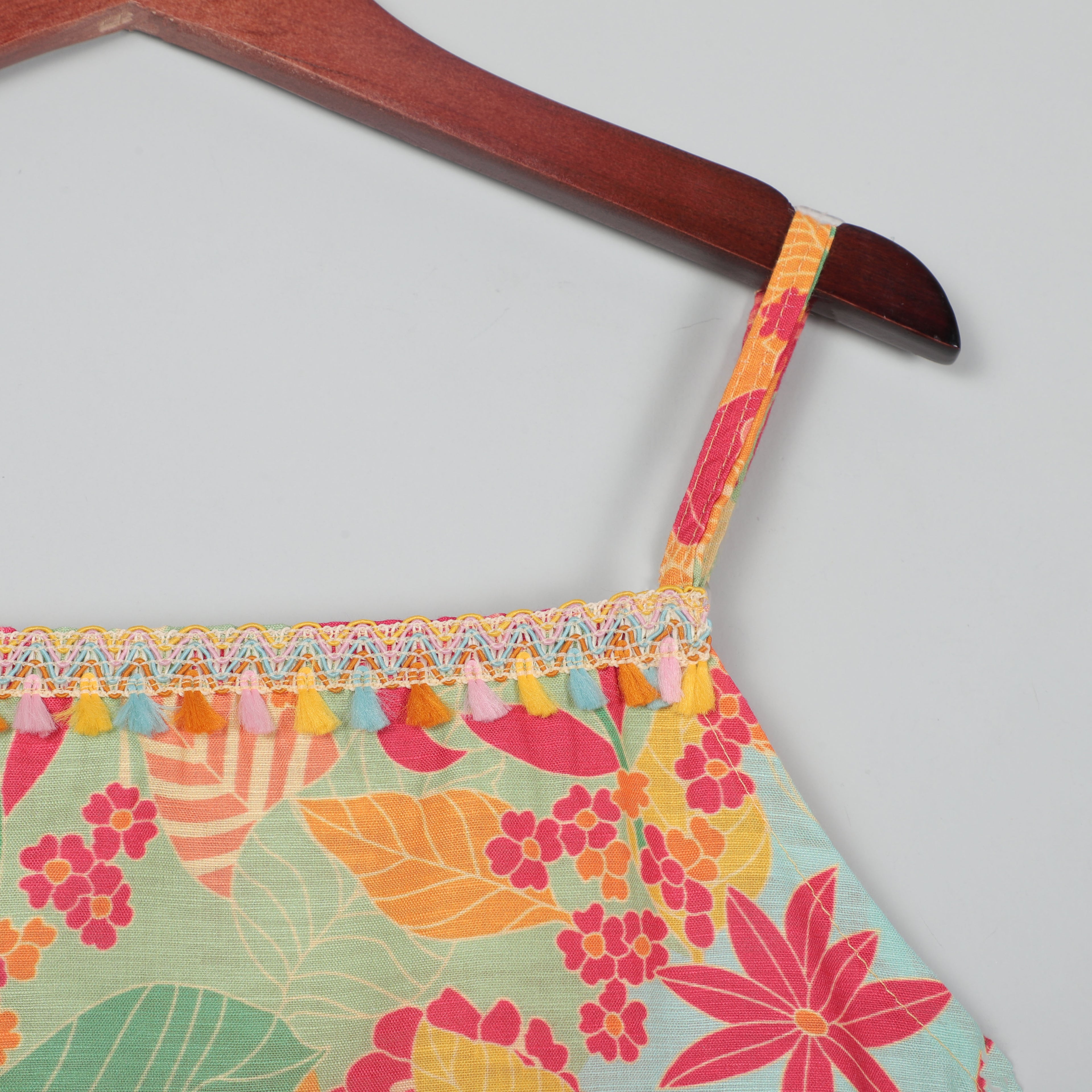 Strappy Top With Adjustable Knots To Tie  At The Back And Striped Pant